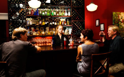 People sitting at the bar at Brownstone Restaurant.